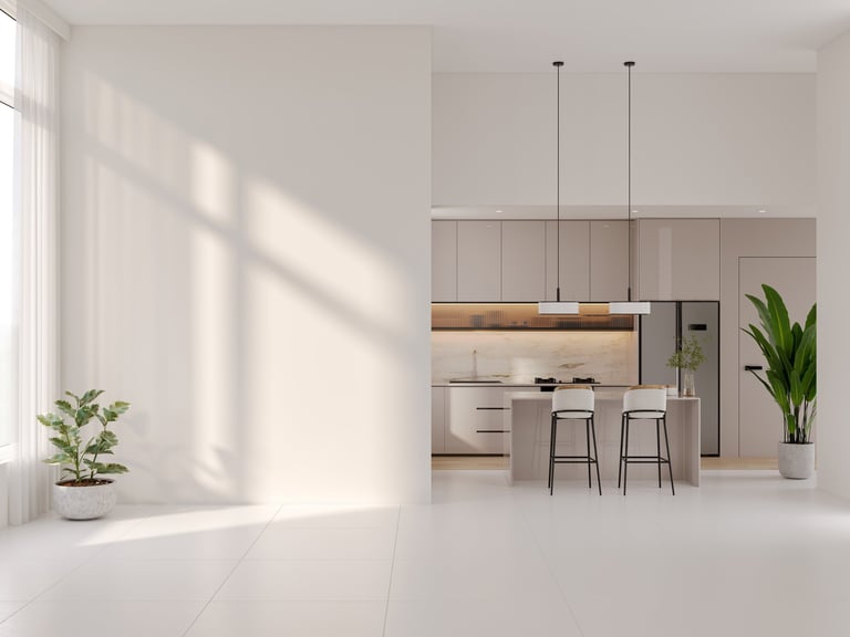 Empty room with spacious and minimalist open-plan interior with large empty wall and white flooring and modern kitchen island