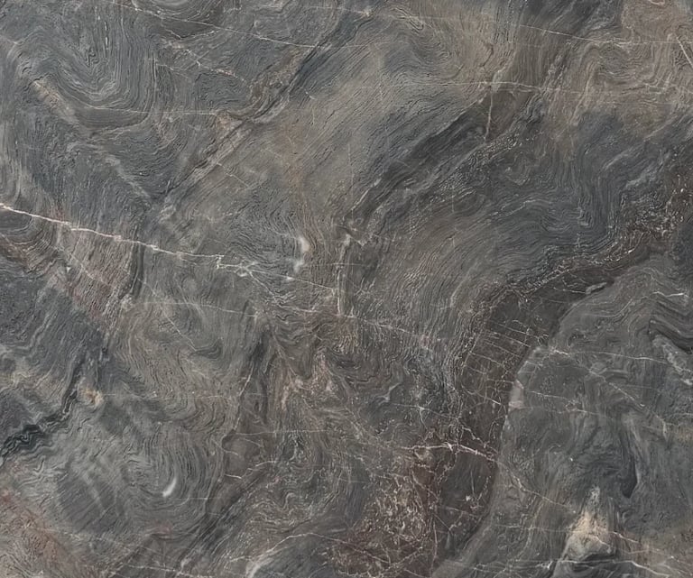 Aerial view of arid, barren landscape with winding erosion patterns and sparse vegetation