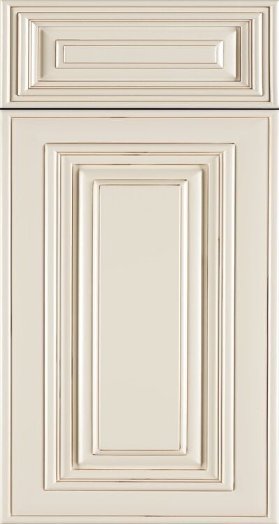 Cream-colored cabinet door and drawer front with recessed rectangular panel design and decorative trim detailing
