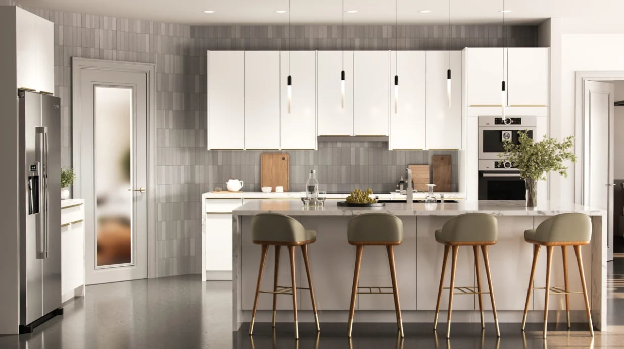 Modern kitchen with white cabinetry, gray subway tile backsplash, island with four bar stools, and stainless steel appliances