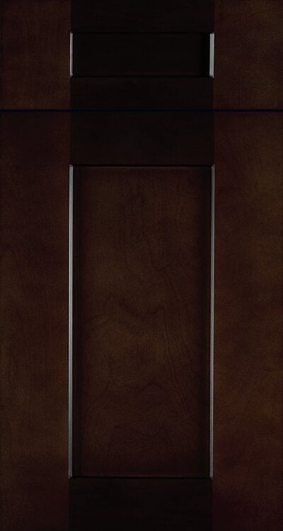 Dark wooden cabinet door with metal handles against textured brown background