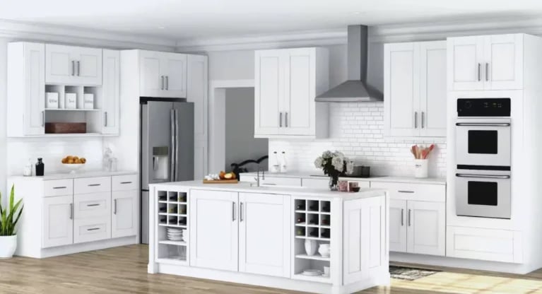 Modern white kitchen with island, stainless steel appliances, white subway tile backsplash, and wood flooring